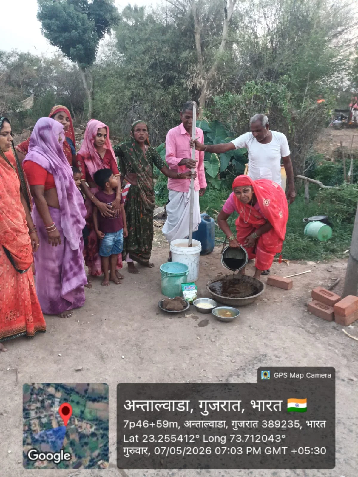 Rural women and farmers participating in a natural agricultural input preparation demonstration
